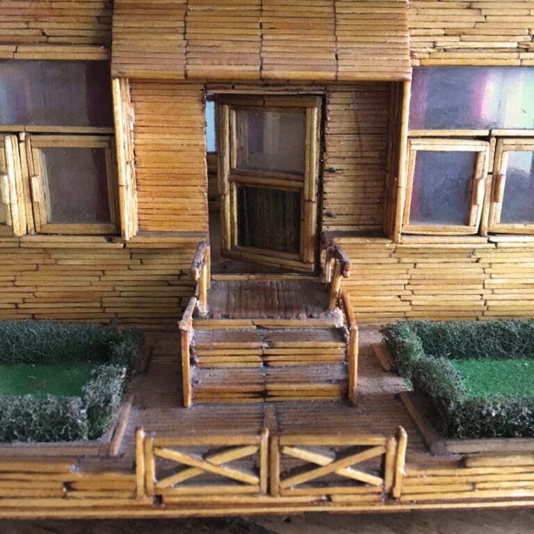 Folk art matchstick house model with hinged roof