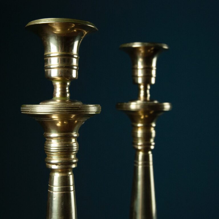 engine-turned brass candlestick pair