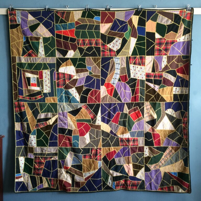Antique wool and silk crazy quilt in 16 embroidered blocks, dated 1910