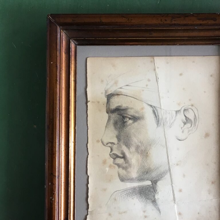 Antique pencil portrait of a man in a copper-colored 19th-century frame