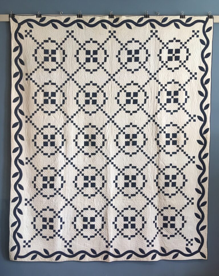 1850s blue and white Burgoyne Surrounded quilt with vine border