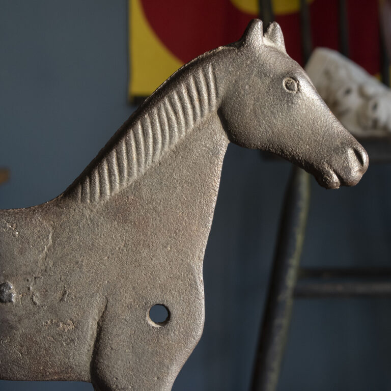 Dempster cast iron horse windmill weight on a stand