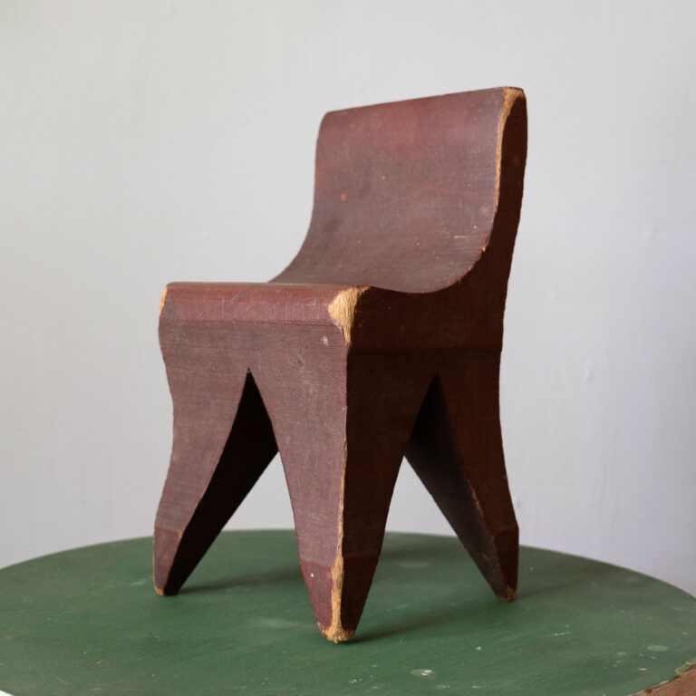 Miniature folk art chair in early red paint