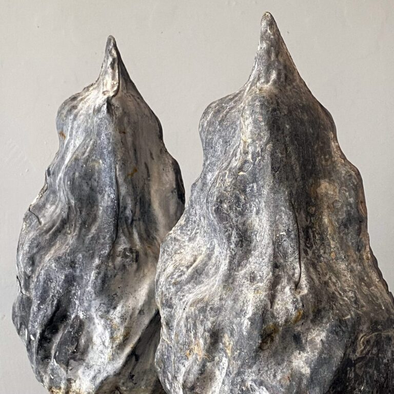 Pair of zinc flame-shaped architectural ornaments, 19th-c.