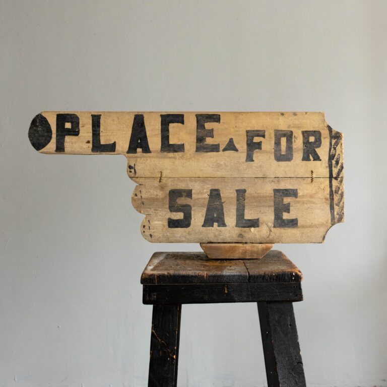 Hand-shaped Place for Sale painted sign in yellow and black