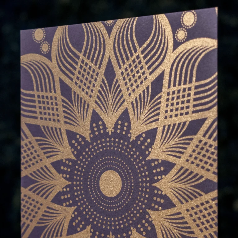 Kolam design letterpress notecards in metallic bronze on amethyst paper