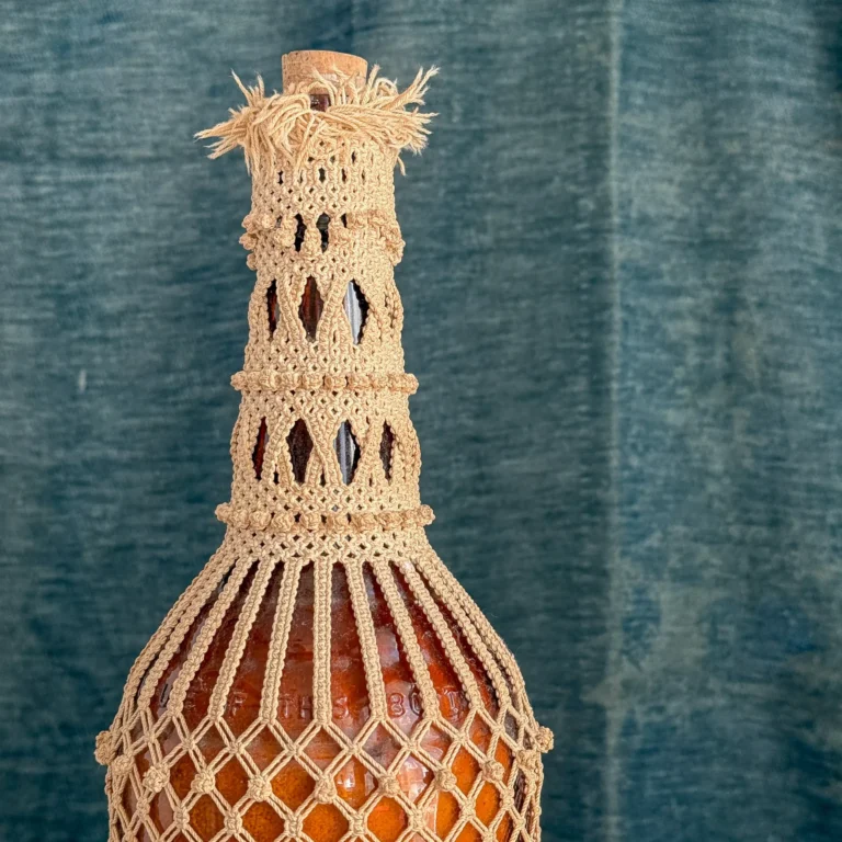 Detail: Sailor's macramé knotwork covered bottle, maritime folk art