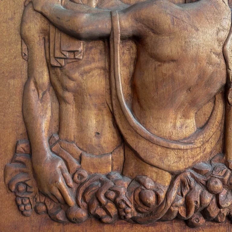 Carved Wood Panel of Two Embracing Male Figures